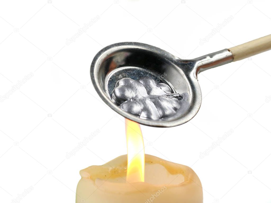 Wax Pouring At New Years Eve, alternative to lead pouring on white background