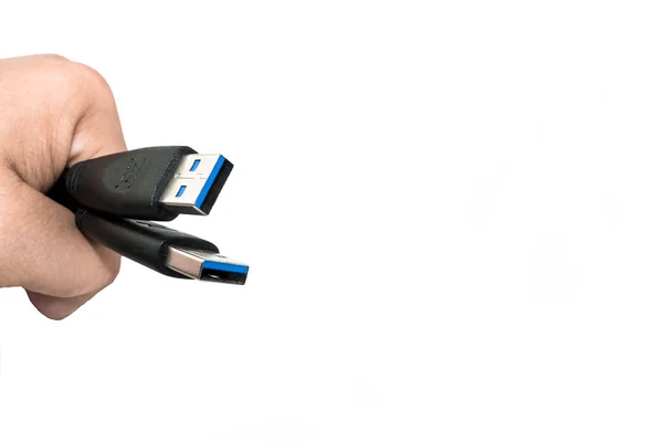 Hand holding USB 3 data cable isolate — Stock Photo, Image