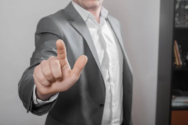 Businessman pointing his fingers up