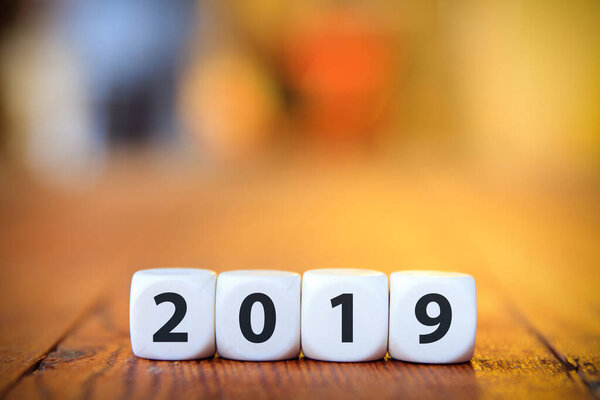 Cubes with 2019 on a wooden table.  