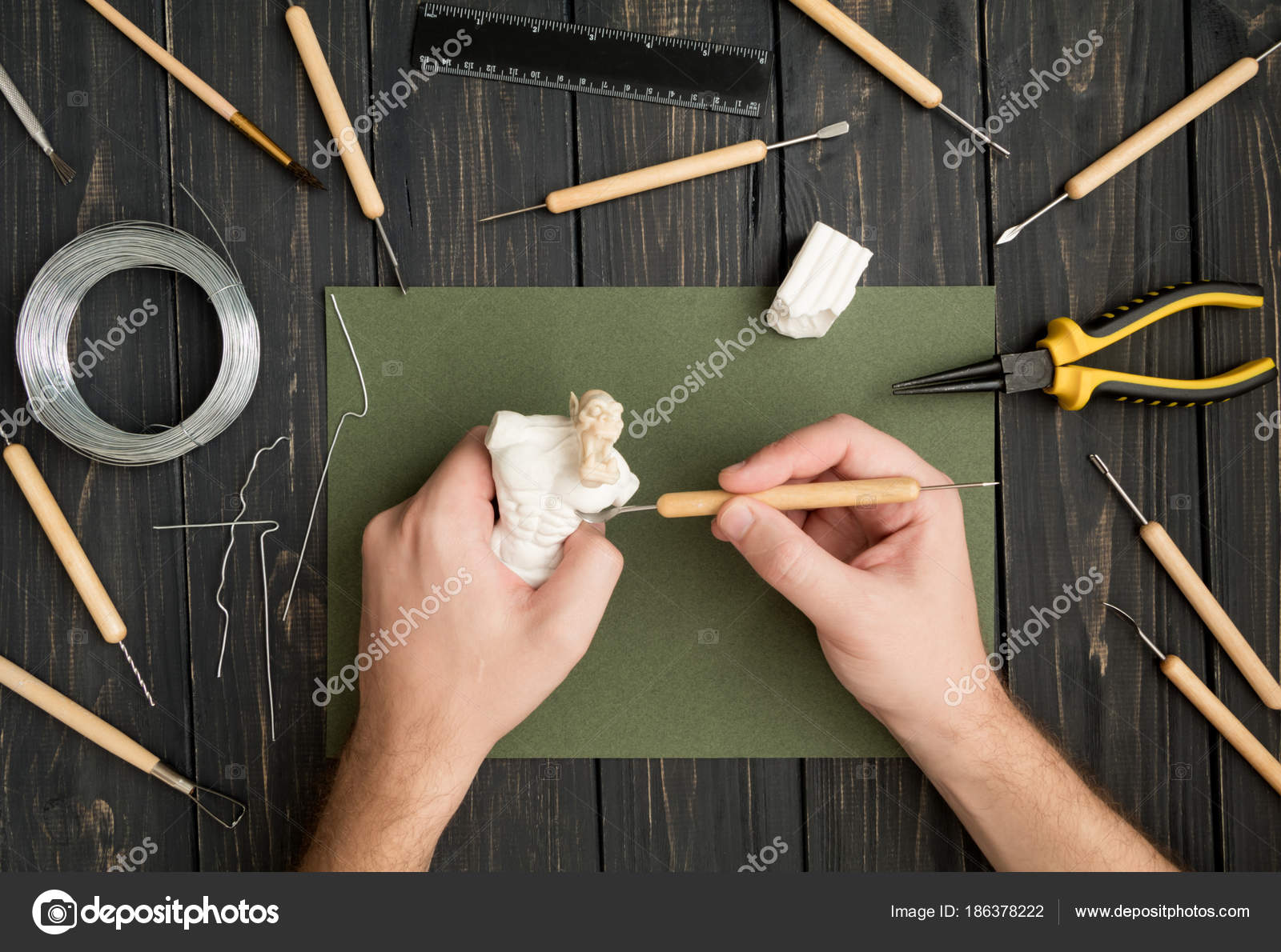Craftsman Hands Working On Orc Sculpture Sculpturing From Polymer