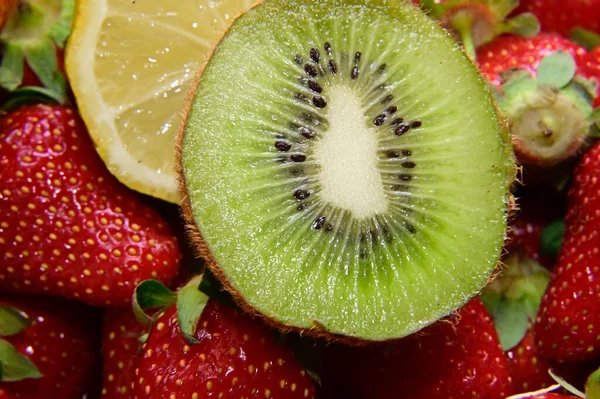 set of ripe fruits on black background, healthy food concept