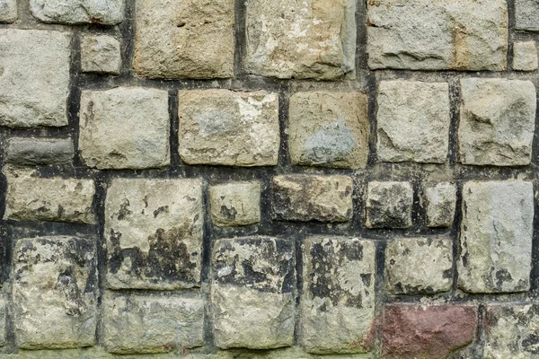 Stará kamenná zeď s kameny čtvercové — Stock fotografie