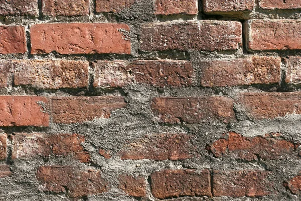 Die Wand des alten Gebäudes ist aus rotem Ziegelstein. Textur oder Hintergrund — Stockfoto