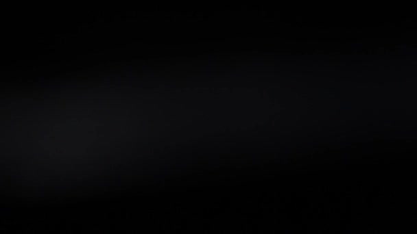 Desenfoque de la luz desenfocada de la lámpara incandescente sobre fondo negro HD — Vídeo de stock