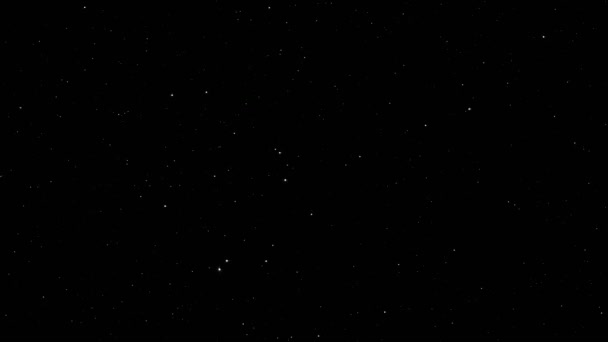 Slow motion of white particles in space in the form of small stars on a black background — Stock Video