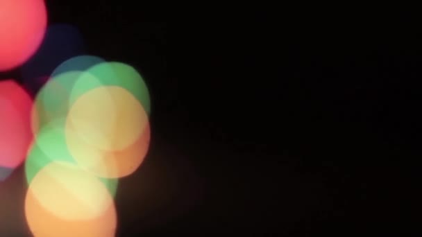 Flying defocused multicolored circles on a black background HD 1920x1080 — Stock Video