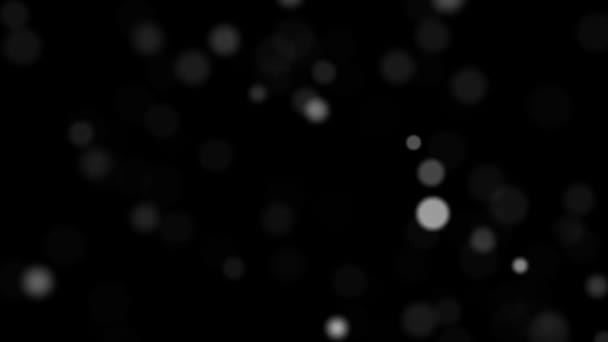 Siyah arka planda beyaz renkli yuvarlak şekilli hızlı uçan mikro parçacıklar. — Stok video