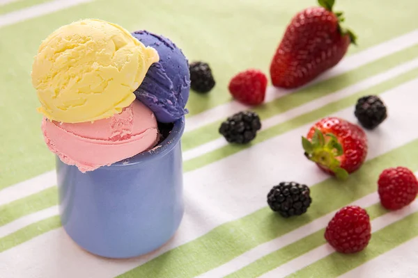 Fruit ice cream in sundae and fruit on table isolated on white background. Summer life style