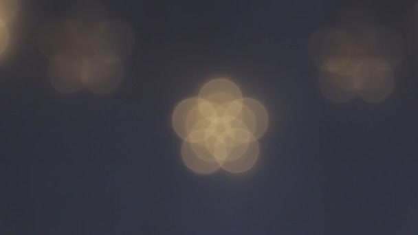 A group of large blurry lights light up and go out, blink at a different pace — 图库视频影像