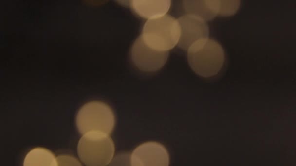 Circular motion of a group of blurry lights in the form of three five-pointed stars — Stock Video