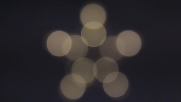 Étoile lumineuse à cinq branches de lumières floues blanches — Video