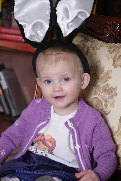 Little Girl Bunny Ears Sits Chair — Stock Photo, Image