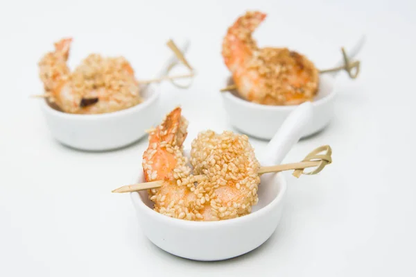 Fried shrimp with sesame seeds. Various snacks — Stock Photo, Image