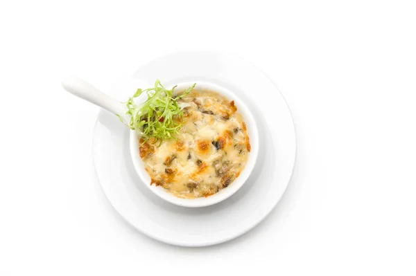 Julienne with chicken and mushrooms in a white bowl Royalty Free Stock Images