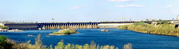 Dnieper Hydro plant DneproGES in Zaporizhzhia, Ukraine. Panoramic view. DniproGES is one of the symbols of Zaporozhye, built in 1932. It is the brightest city landmark and ecological power plant.