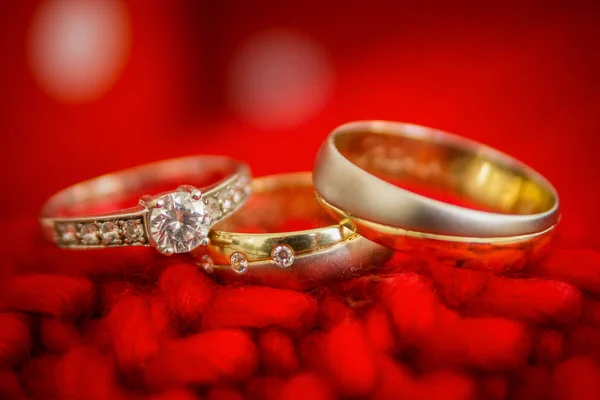 wedding rings. gold ribbons. rings. gold and silver.