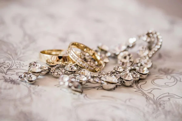 wedding rings. gold ribbons. rings. gold and silver.