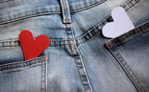 Blue jeans with the red and white heart in the pockets.
