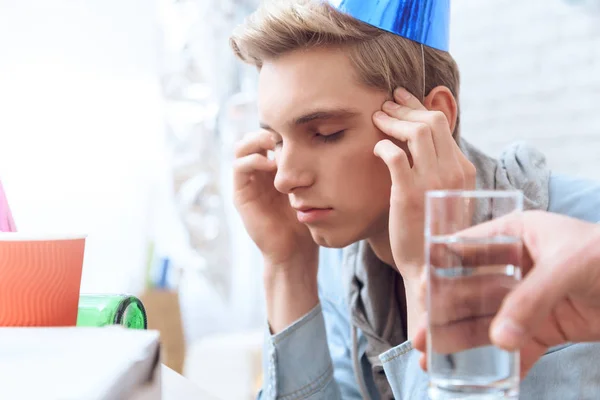 Son Having Headache Birthday Party Father Giving Him Glass Water — Stock Photo, Image