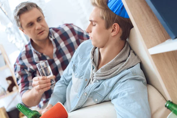 Son Having Headache Birthday Party Father Giving Him Glass Remedy — Stock Photo, Image