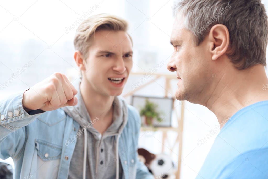 Father intimidating troubled teenager during quarrel