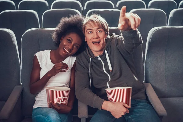 Multinational couple is watching comedy in cinema. — Stock Photo, Image