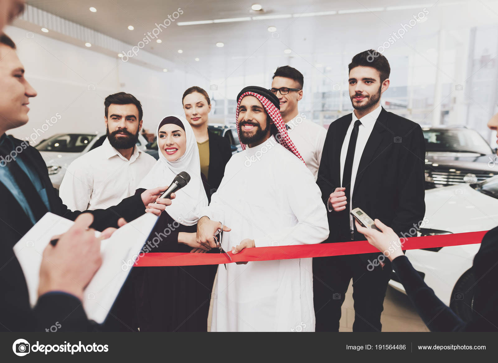 Arabic Man Thawb Opening New Dealership His Wife Stock Photo by