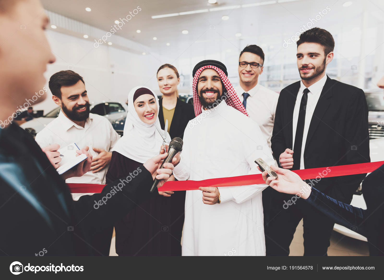 Arabic Man Thawb Opening New Dealership His Wife Stock Photo by