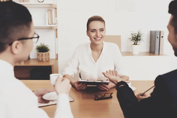 HR director woman in blouse and skirt sitting at job interview