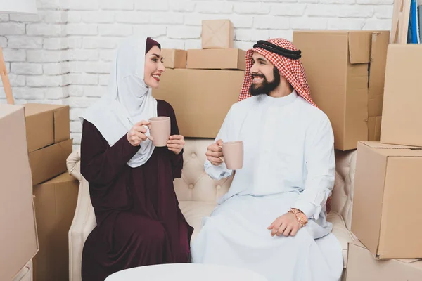 Happy Arab Couple Drinking Coffee Sitting Sofa New Apartment — Stock Photo, Image