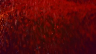 Sıcak renkli parçacıklar her yerde kaynıyor. Bu bir açıklanamaz belirli vibe ile çok dinamik Özet video döngü