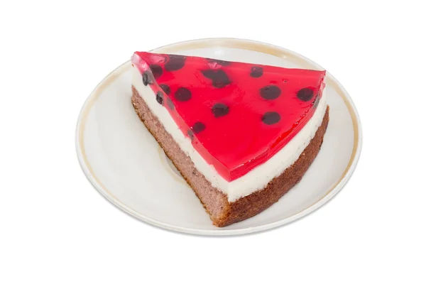 Piece of layered cake with berry jelly on a saucer — Stock Photo, Image