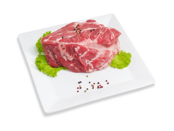 Piece of a fresh uncooked pork neck on square dish — Stock Photo, Image