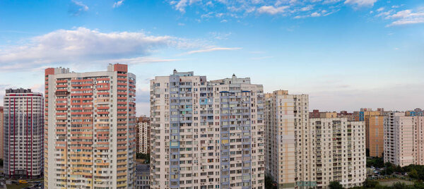Panorama of modern multistory housing estate against the evening sk