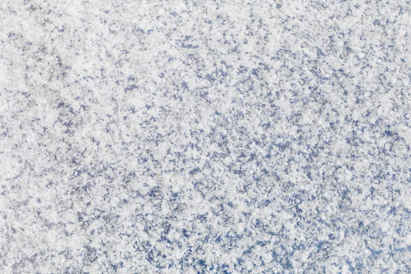 Фон синей поверхности, покрытой пушистым снегом — стоковое фото