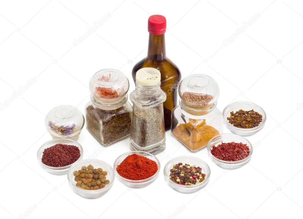 Various spices and sauce in different small glassware