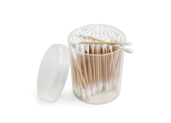 Cotton swabs in round plastic container on a light background — Stock Photo, Image