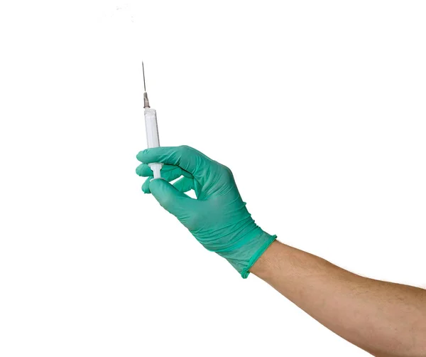 Medizinische Spritze in einer männlichen Hand mit medizinischem Handschuh — Stockfoto