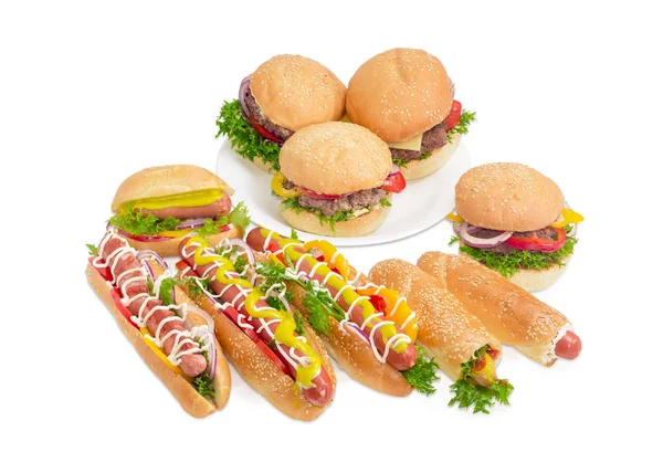Beberapa hamburger yang berbeda dan hot dog dengan latar belakang yang lebih ringan — Stok Foto