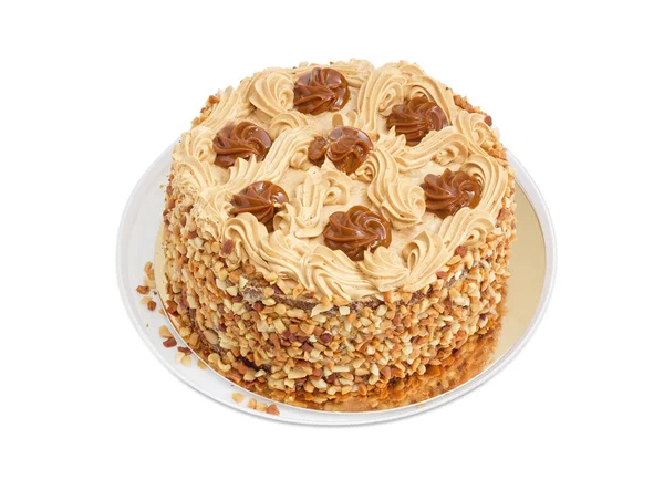 Round sponge cake with butter cream and nuts — Stock Photo, Image
