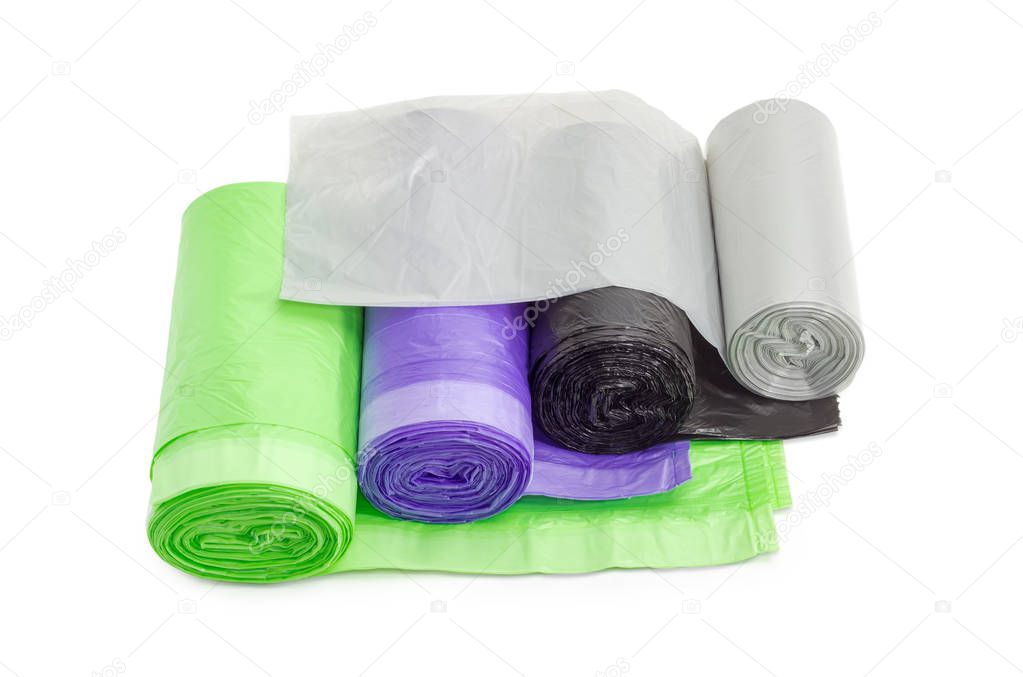 Plastic garbage bags in rolls of different sizes and colors