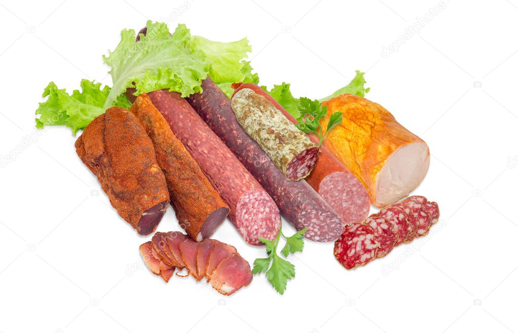 Different cooked meat products with greens on a light background