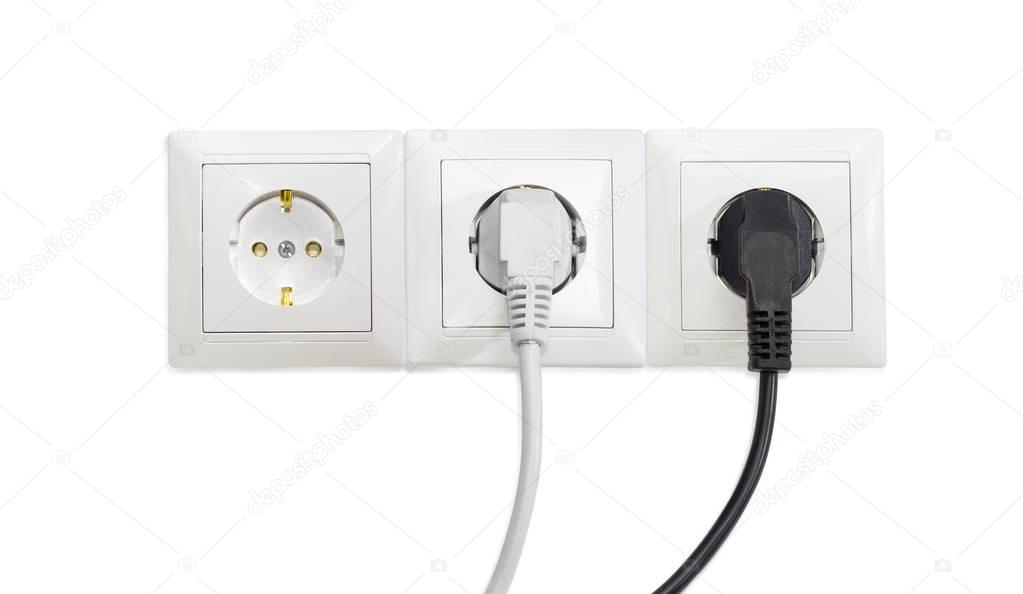 Three white socket outlet with two connected power plugs