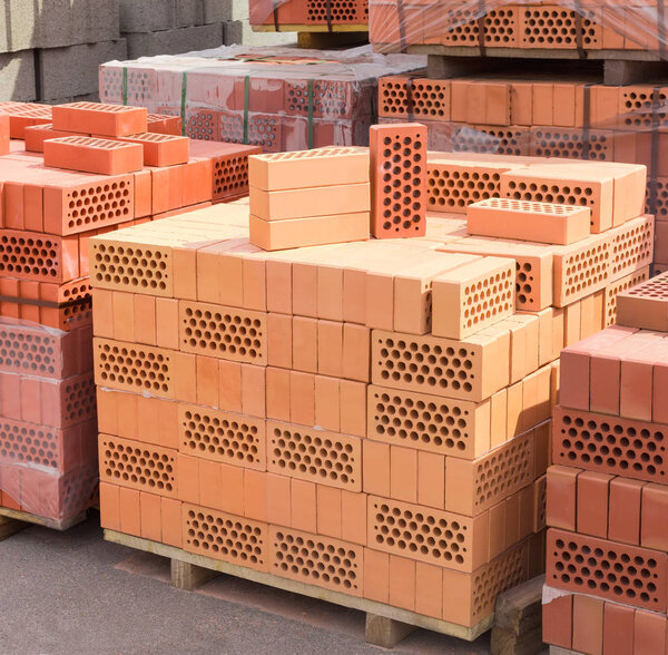 Perforated yellow and red bricks with round holes 
