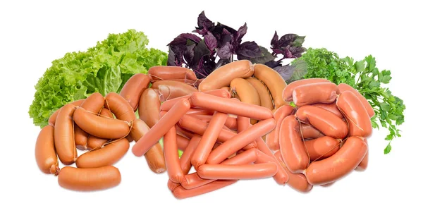 Pile of the uncooked different sausages and various greens — Stock Photo, Image