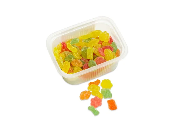 Varicolored suiker snoepjes in kleine plastic container — Stockfoto