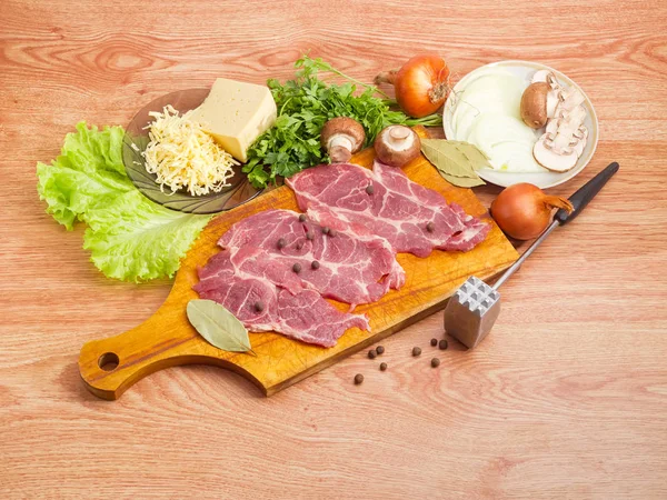 Ingredients for cooking pork chops baked with onion, mushrooms, cheese — Stock Photo, Image