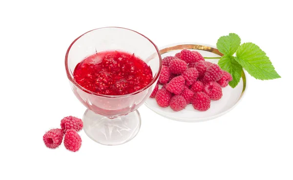 Raspberry jam in glass dessert bowl and fresh raspberries — Stock Photo, Image
