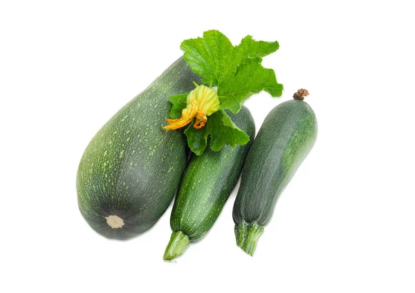 Tre zucchine verde scuro su sfondo chiaro — Foto Stock